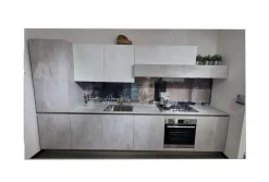 Cucina lineare in laminato materico altri colori Infinity maniglia grip a prezzo ribassato^Stosa New